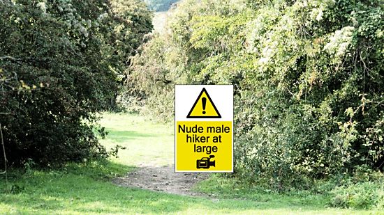 Nude male hiker at large